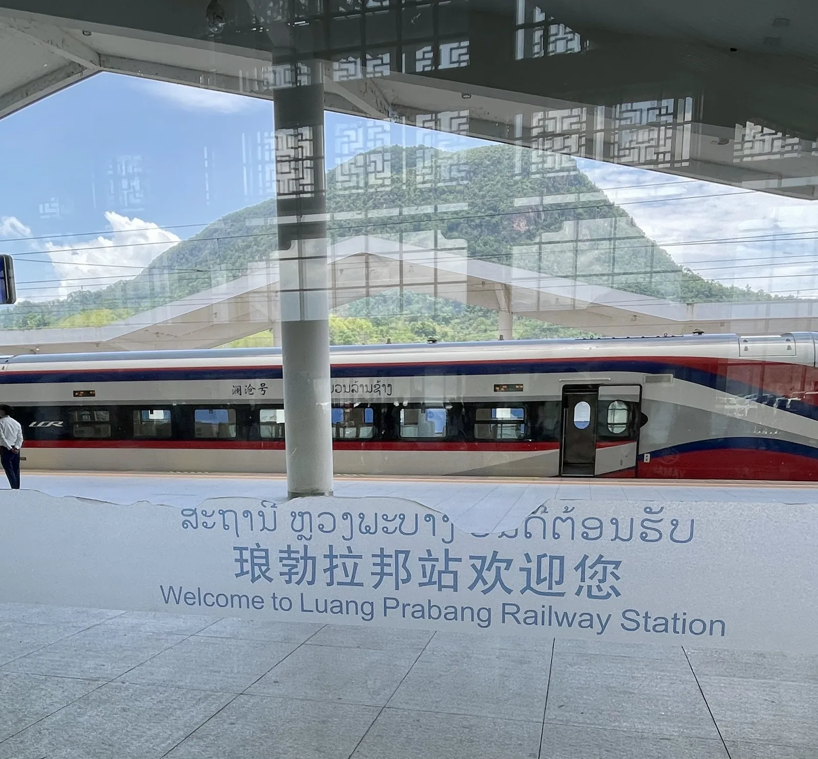 The modern China-Laos railway station with travelers waiting to board
