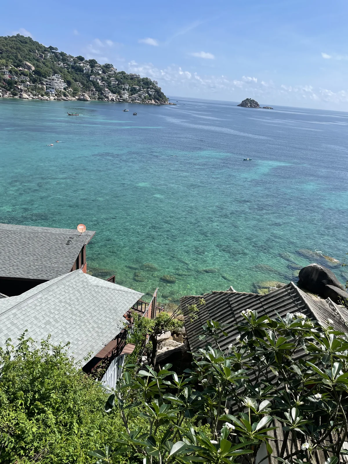 The view from a bungalow overlooking the ocean with an island