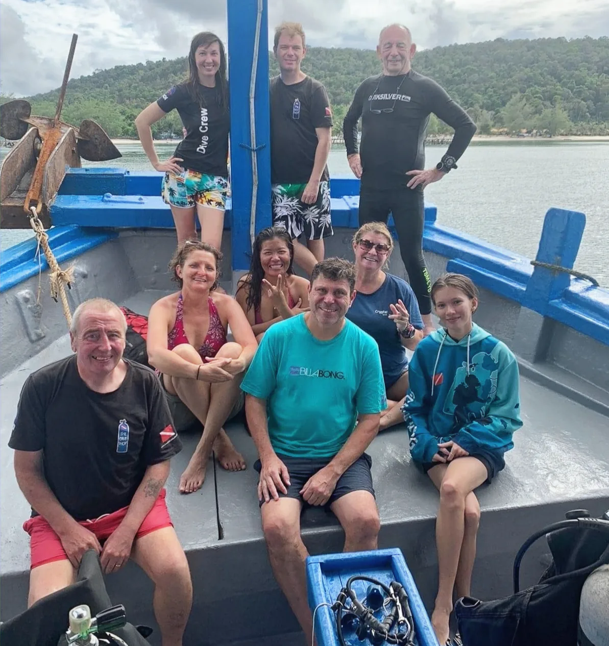 A group of scuba divers on a dive boat