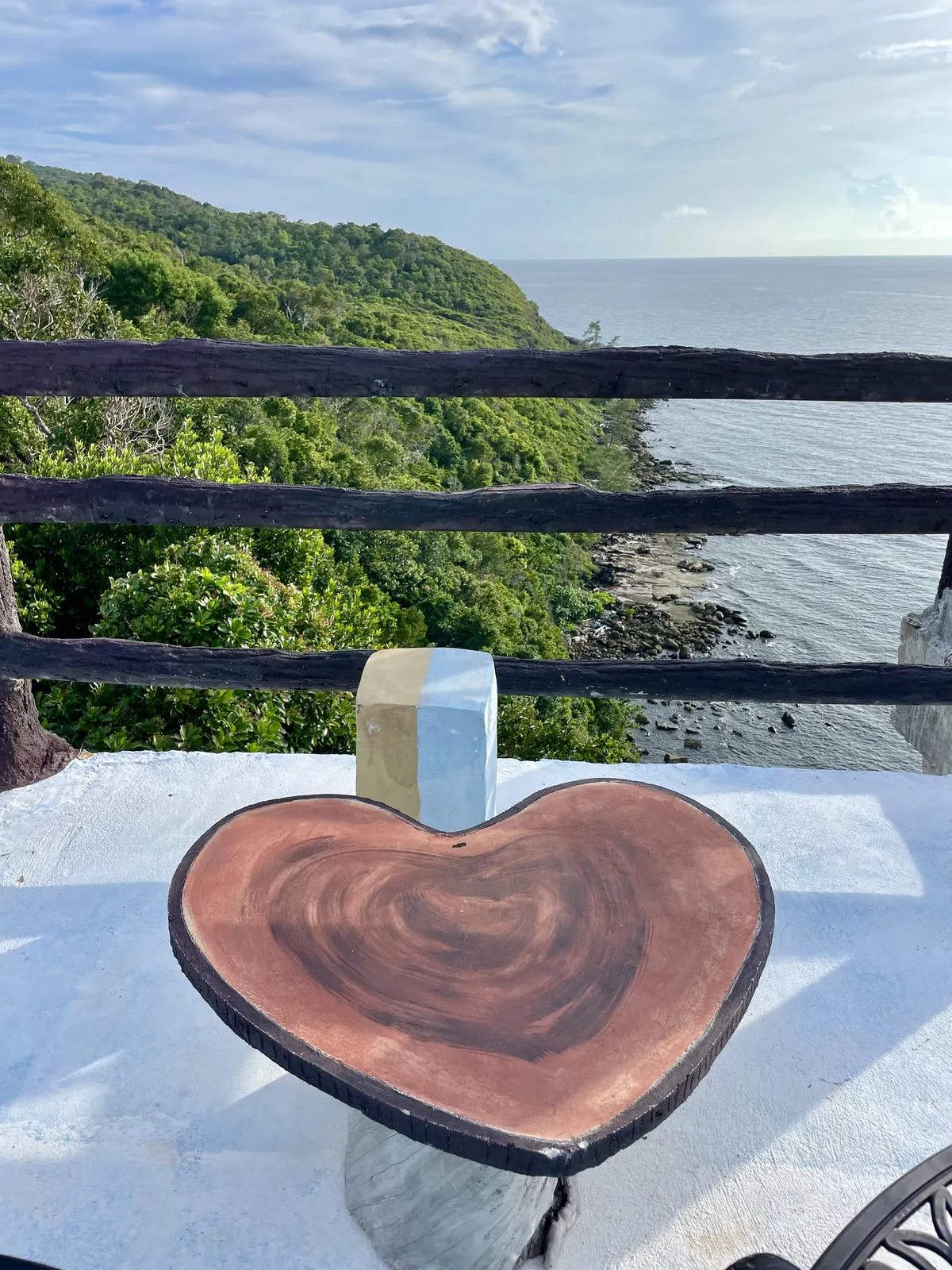 A Wooden heart shaped table overlooking the sea