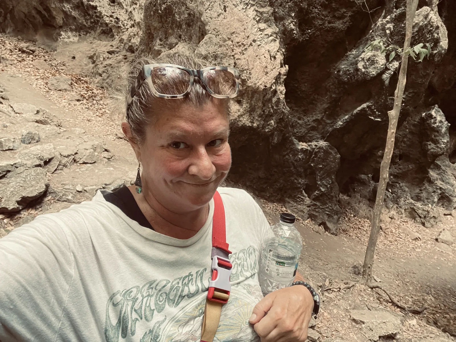 A woman on a hike to a cave in Thailand