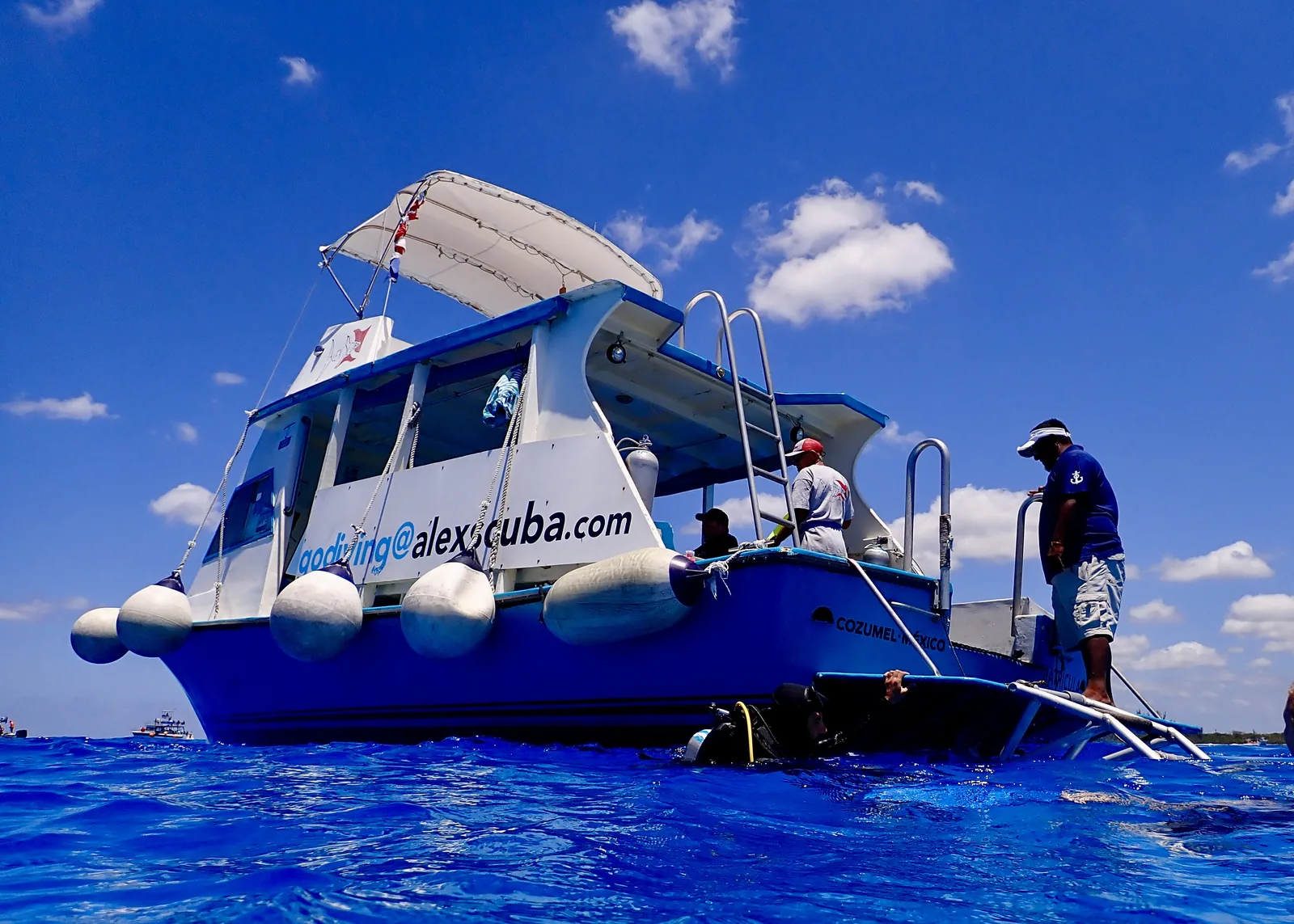 scuba diving boat on blue water in Cozumel