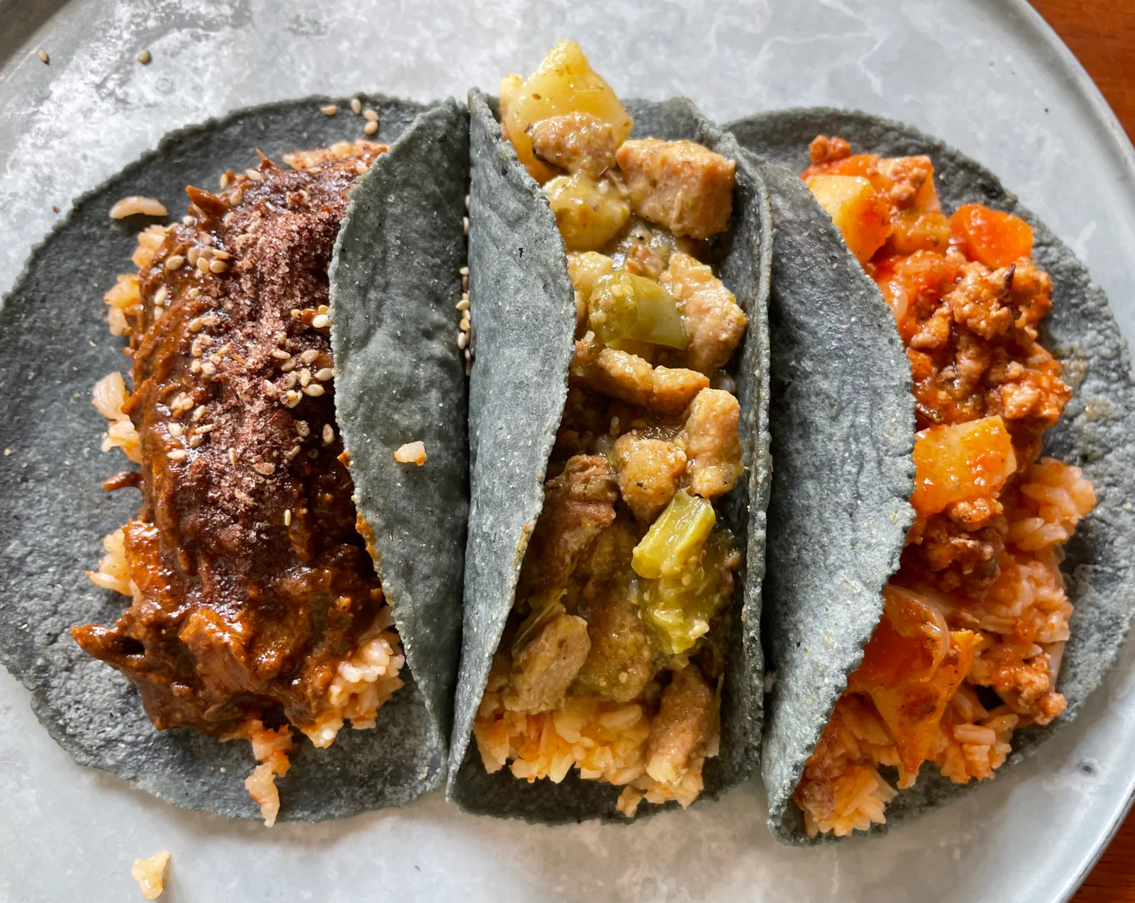 Three tacos in blue corn tortillas