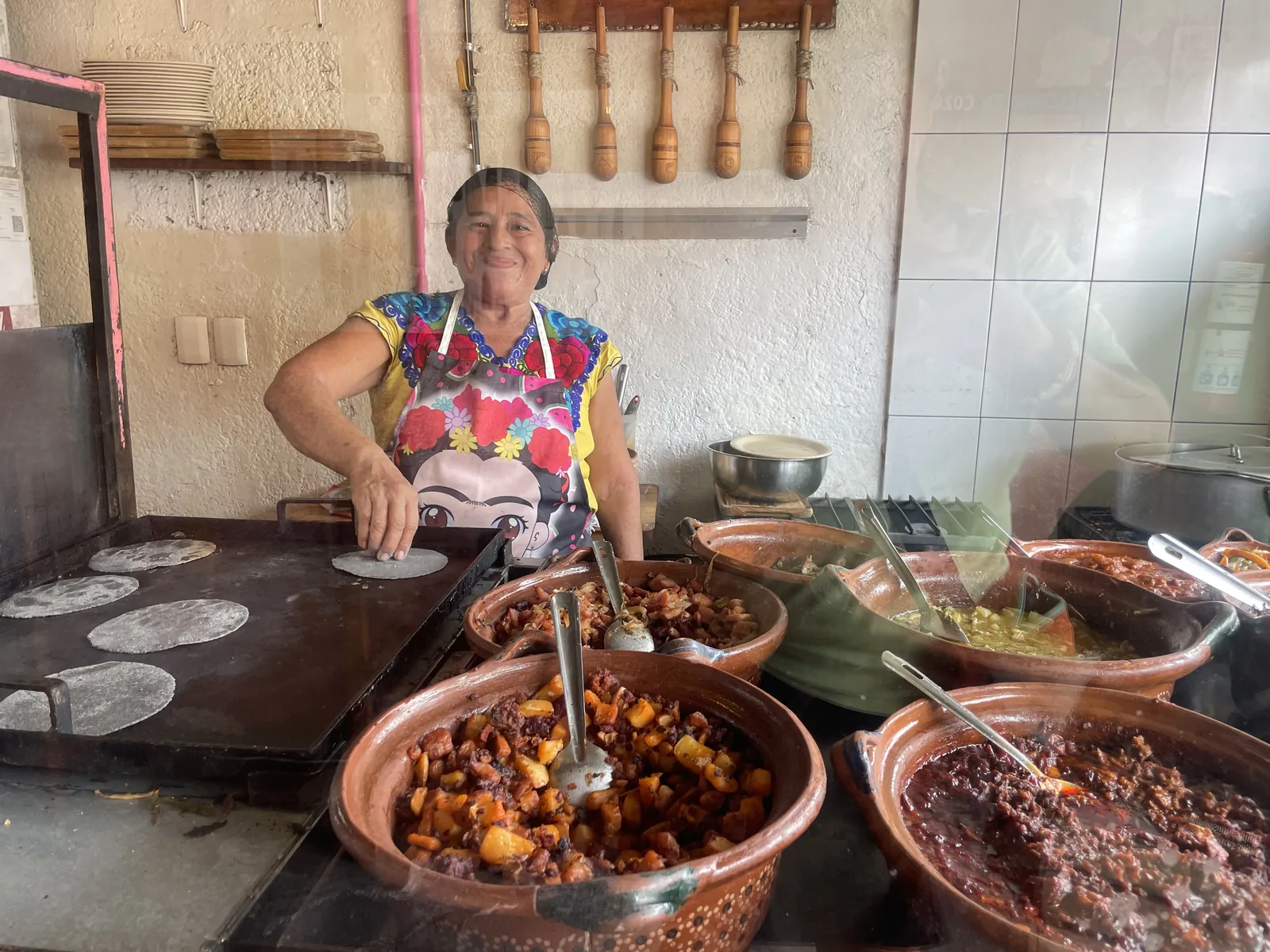 Mexican grandma making tacos in Cozumel