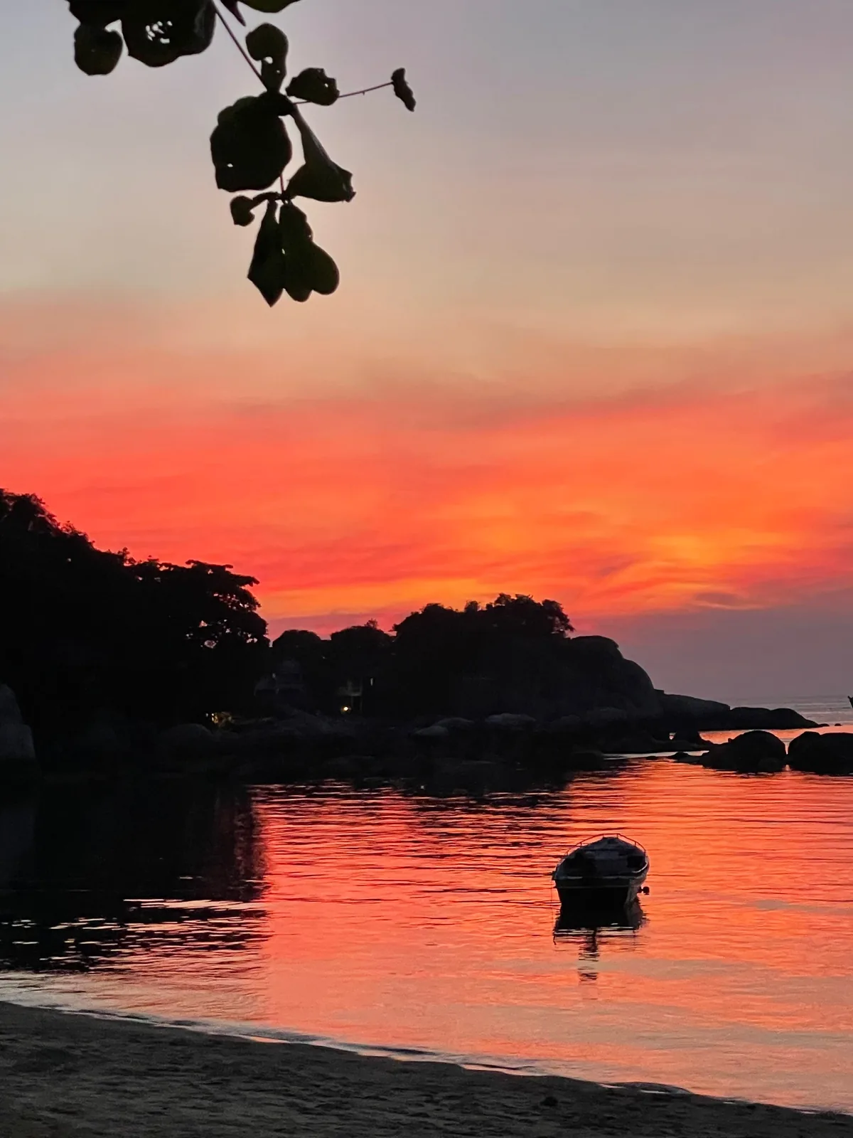 A red sunset on the beach in Koh Tao