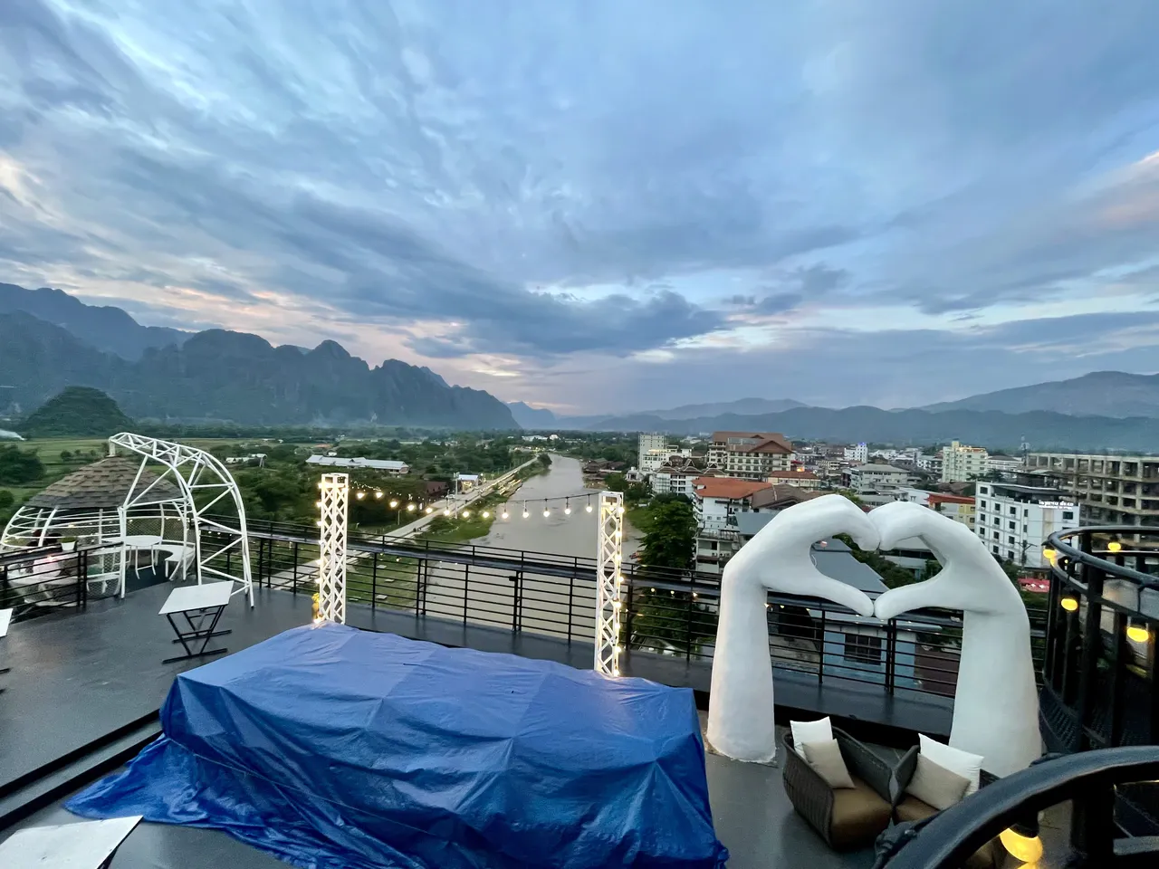 View over Vang Vieng town and the river from the highest rooftop bar at dusk